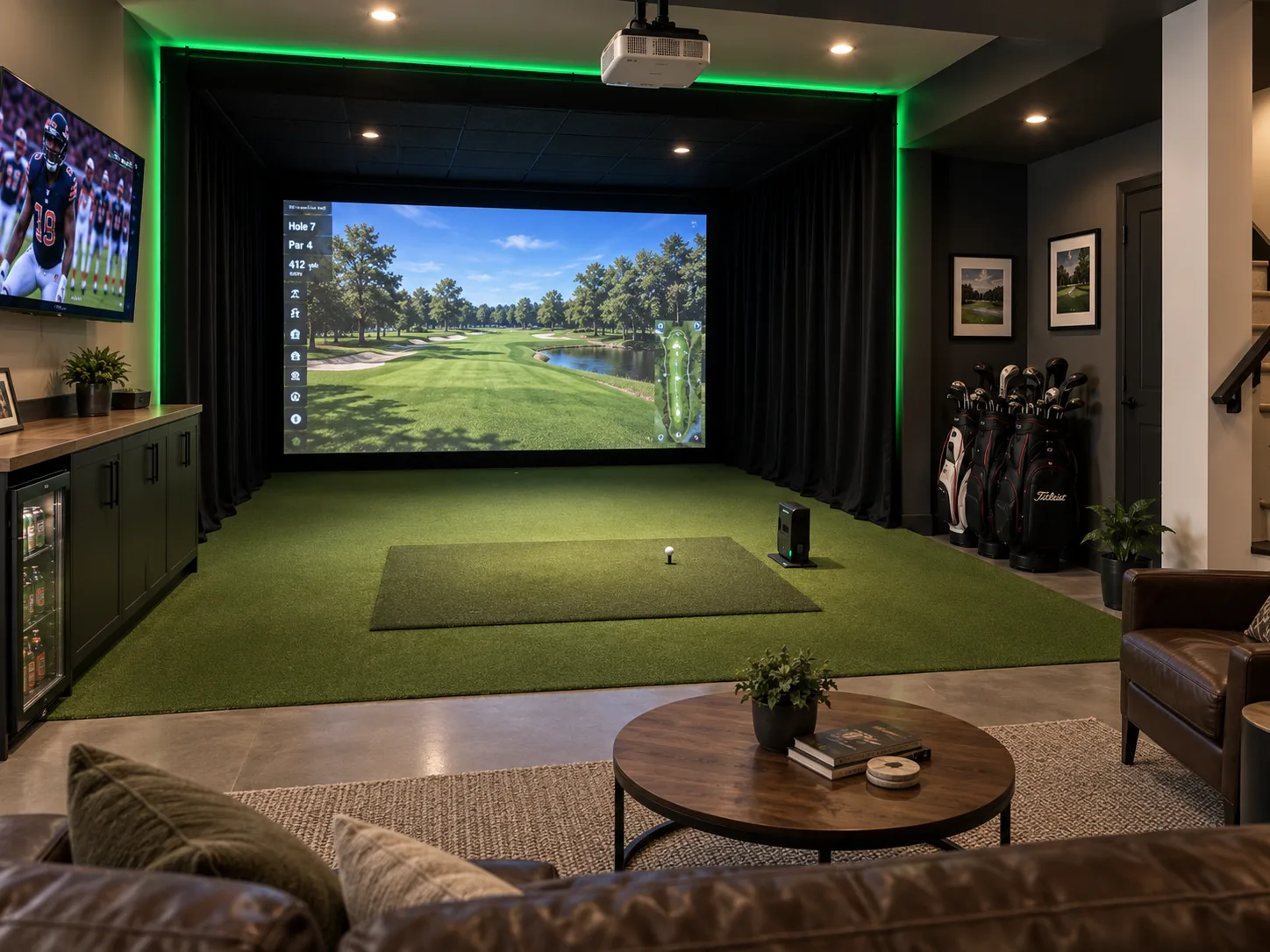 Completed La Grange basement golf simulator with an impact screen, turf, black curtains, green lighting, seating, and a wall-mounted television